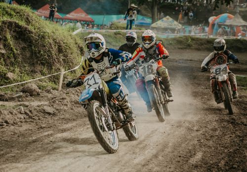 Free Dynamic off-road motorcycle race, capturing the thrill of dirt bike competition in action. Stock Photo