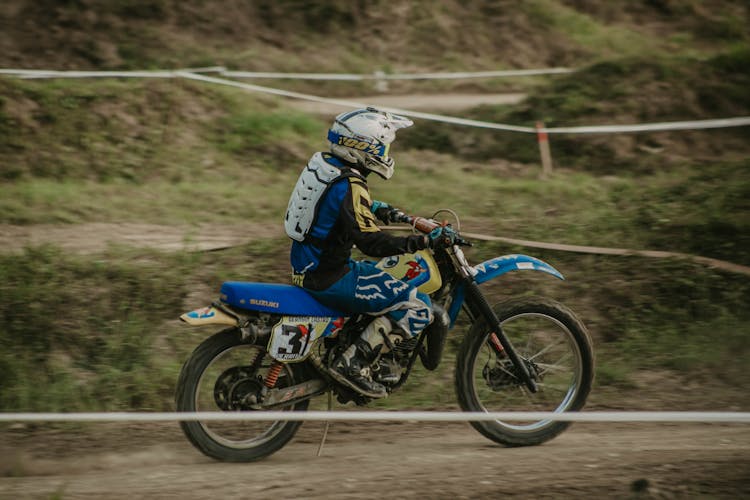 Man In Uniform Riding Motorbike