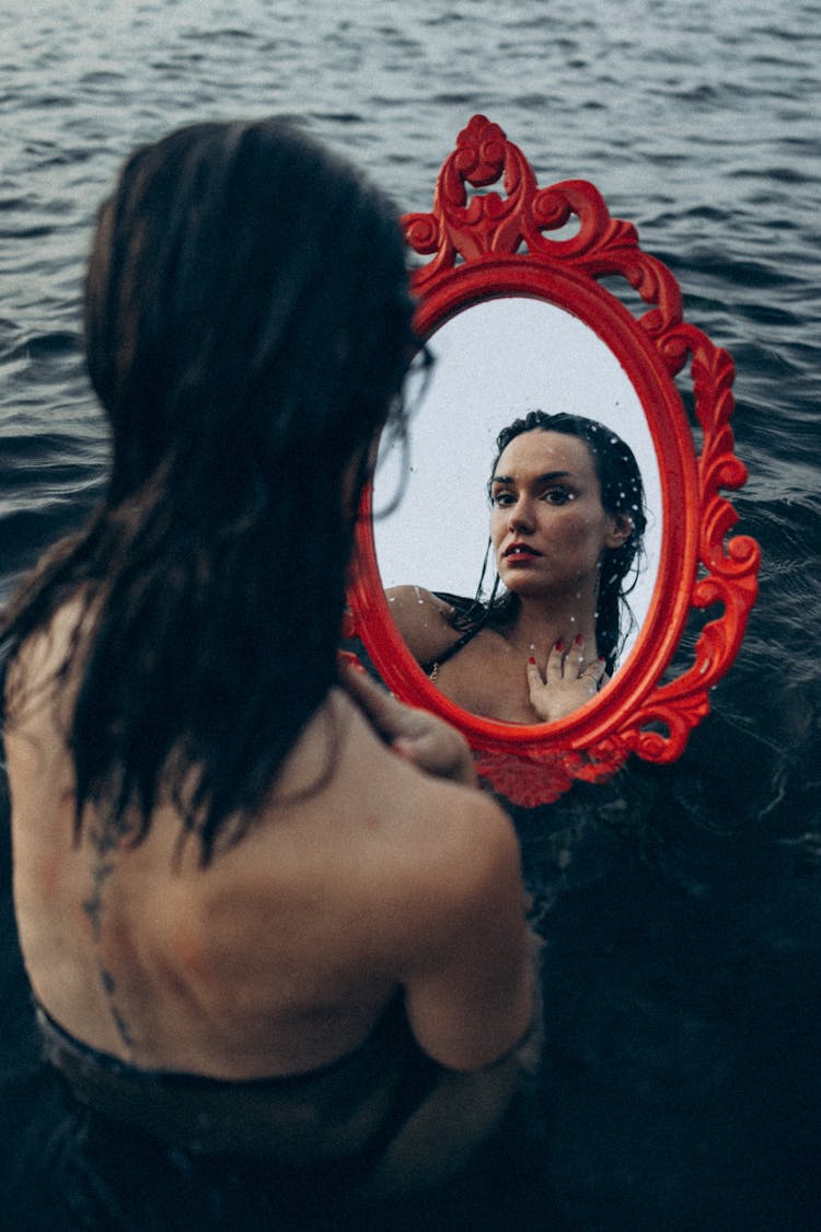 Woman In The Water Looking At A Mirror 