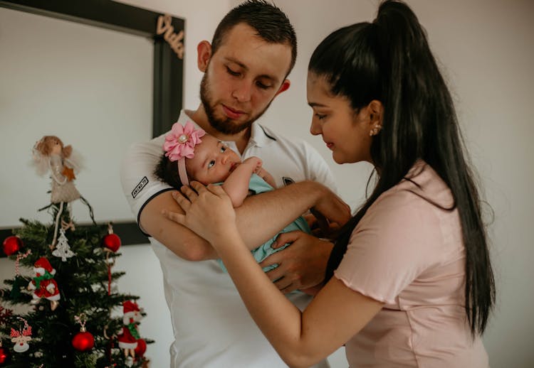 Mother And Father With Baby