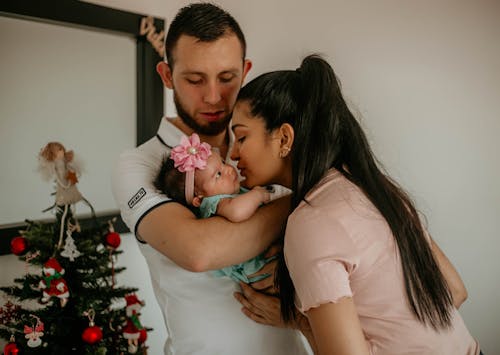 Couple with Baby during Christmas