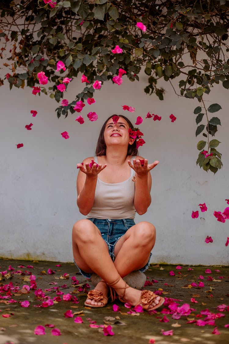 Photo Of A Woman With Falling Flowers 