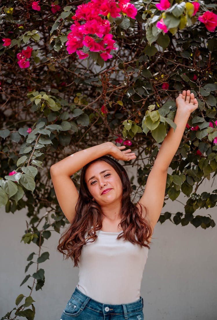 Woman Stretching Under Flowering Plant