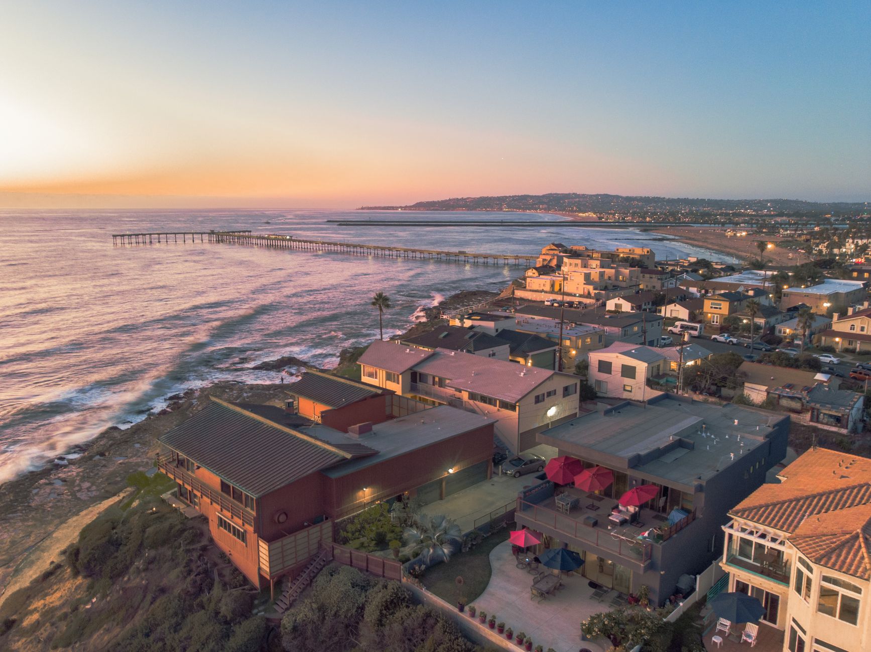Rooftop deck with fire pit overlooking San Diego bay at sunset