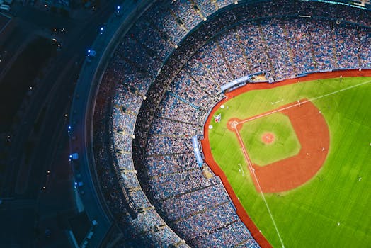 High-angle view of a crowded baseball stadium with green field in Toronto during a game.