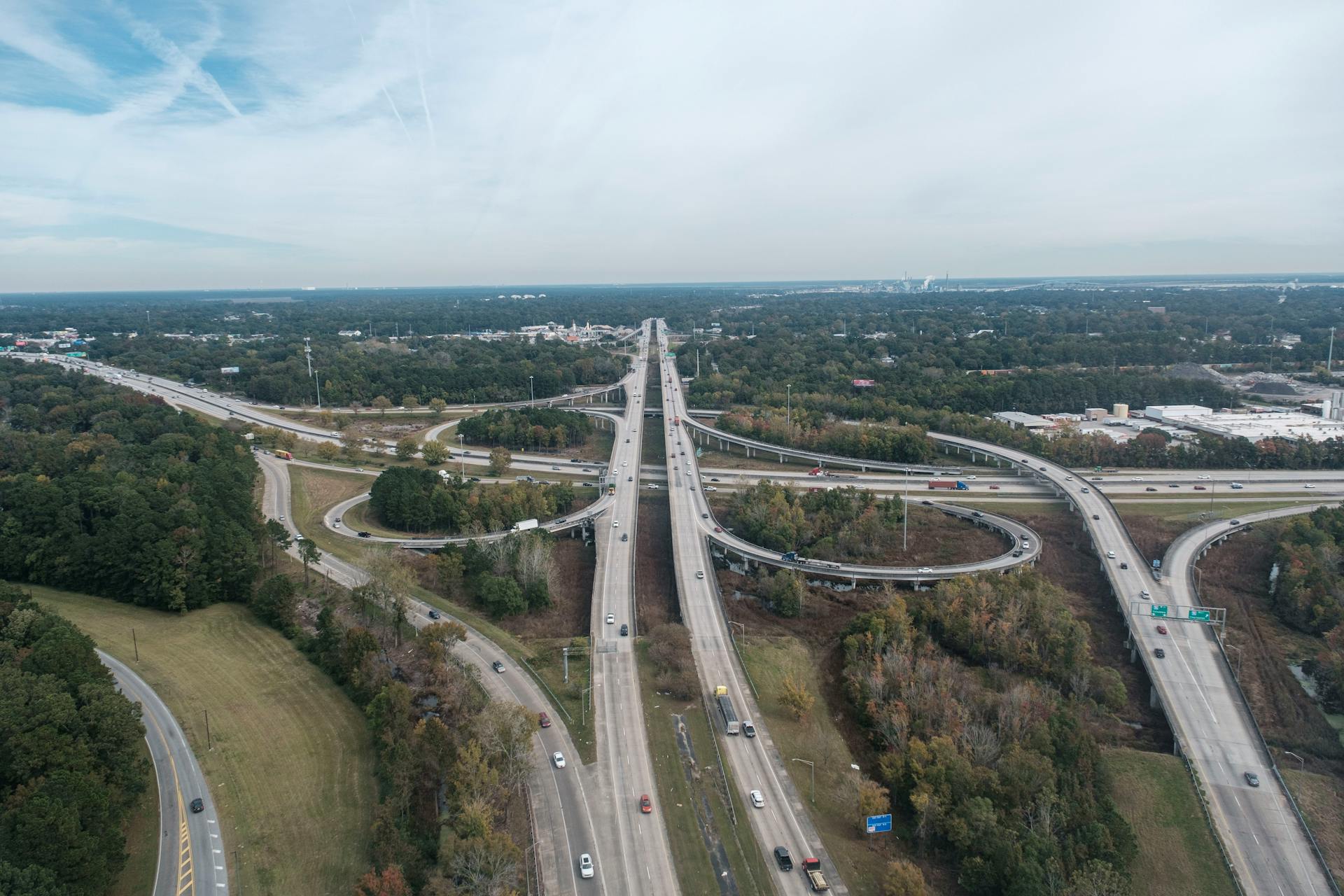 Aerial view of a detailed highway interchange in Charleston, SC, showcasing traffic flow and urban planning.