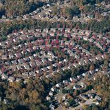 Aerial shot of a circular neighborhood in Fort Mill, SC, showcasing fall foliage and suburban layout.