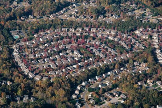 Aerial shot of a circular neighborhood in Fort Mill, SC, showcasing fall foliage and suburban layout.