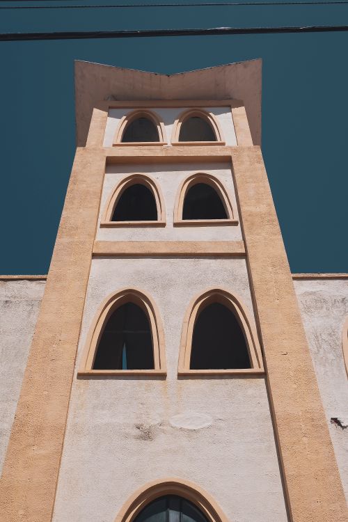Free Low angle shot of a historic building facade in Mérida, Venezuela under clear blue skies. Stock Photo
