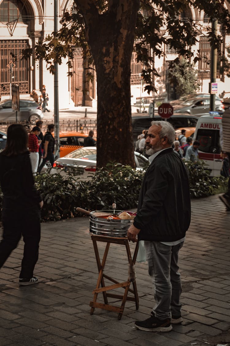 Old Bearded Man Selling Street Food