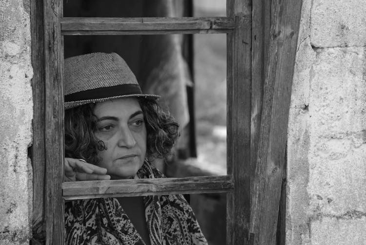 Grayscale Photo Of Woman Wearing Hat