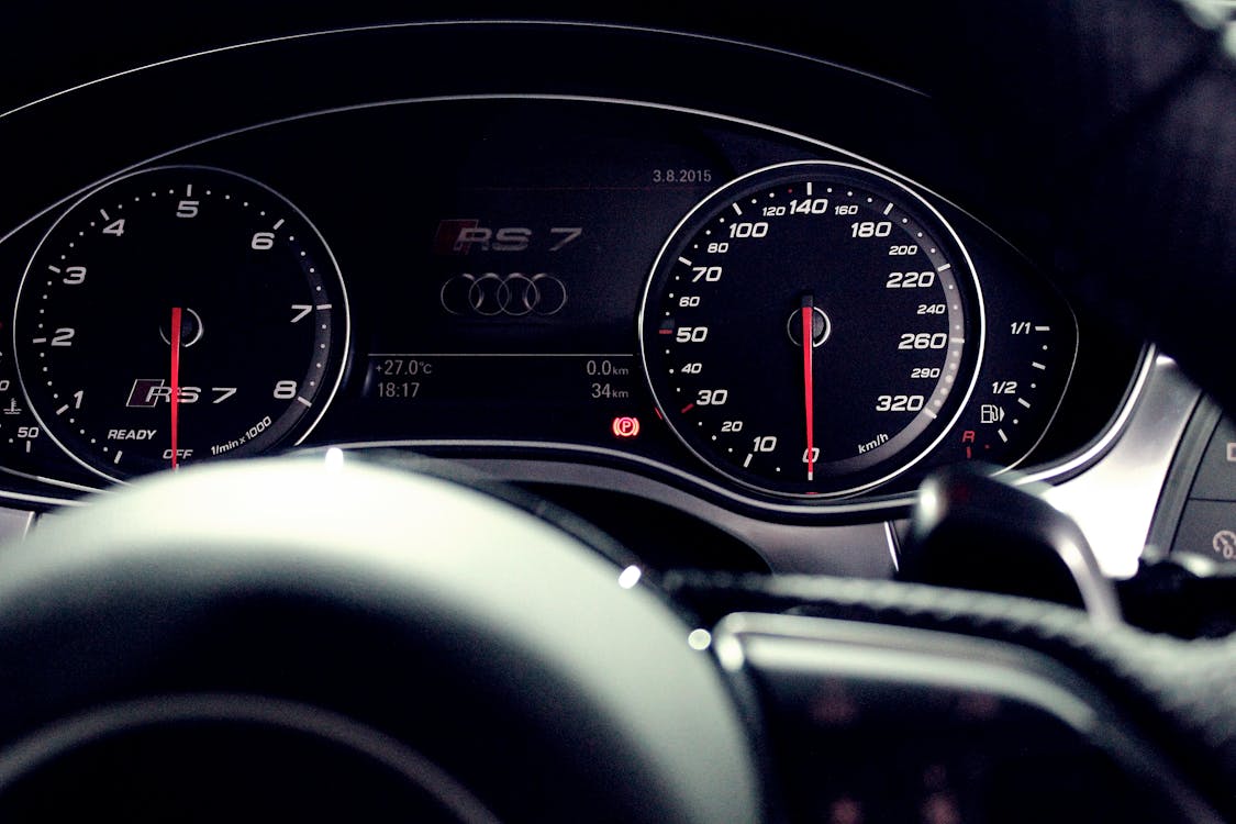 Free Person Showing Audi Rs 7 Speedometer Stock Photo