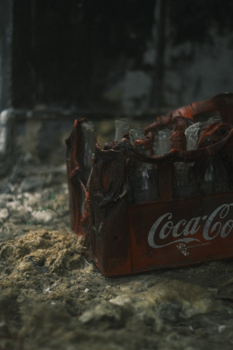 A Close-Up Shot Of A Burnt Bottle Crate