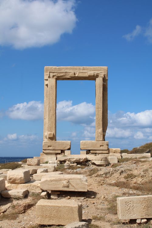 Free Ancient Portara gateway on Naxos Island, Greece, set against a clear blue sky. Stock Photo
