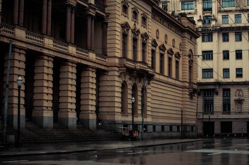 Free Moody view of Municipal Theatre of Sao Paulo with wet streets and classic architecture. Stock Photo