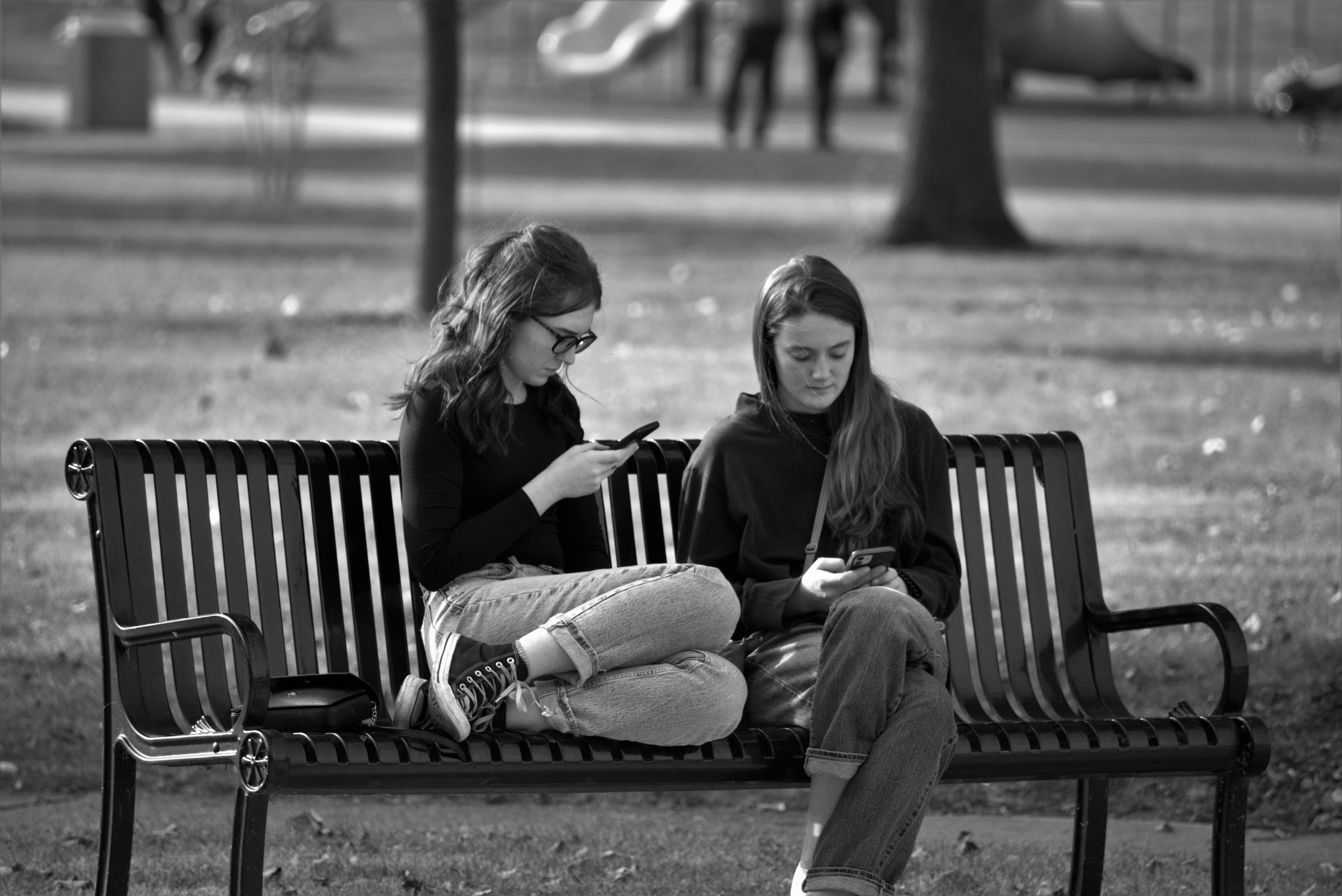 Preoccupied Women on the Park Bench · Free Stock Photo