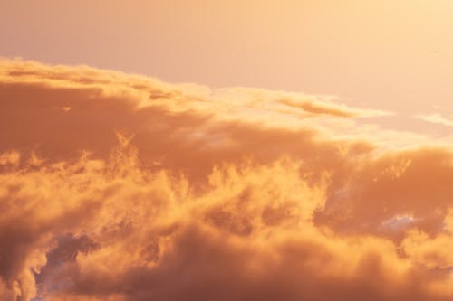 Fluffy Orange Clouds in Close-up Photography