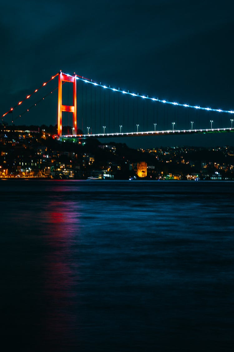 Lit Up Suspension Bridge At Night