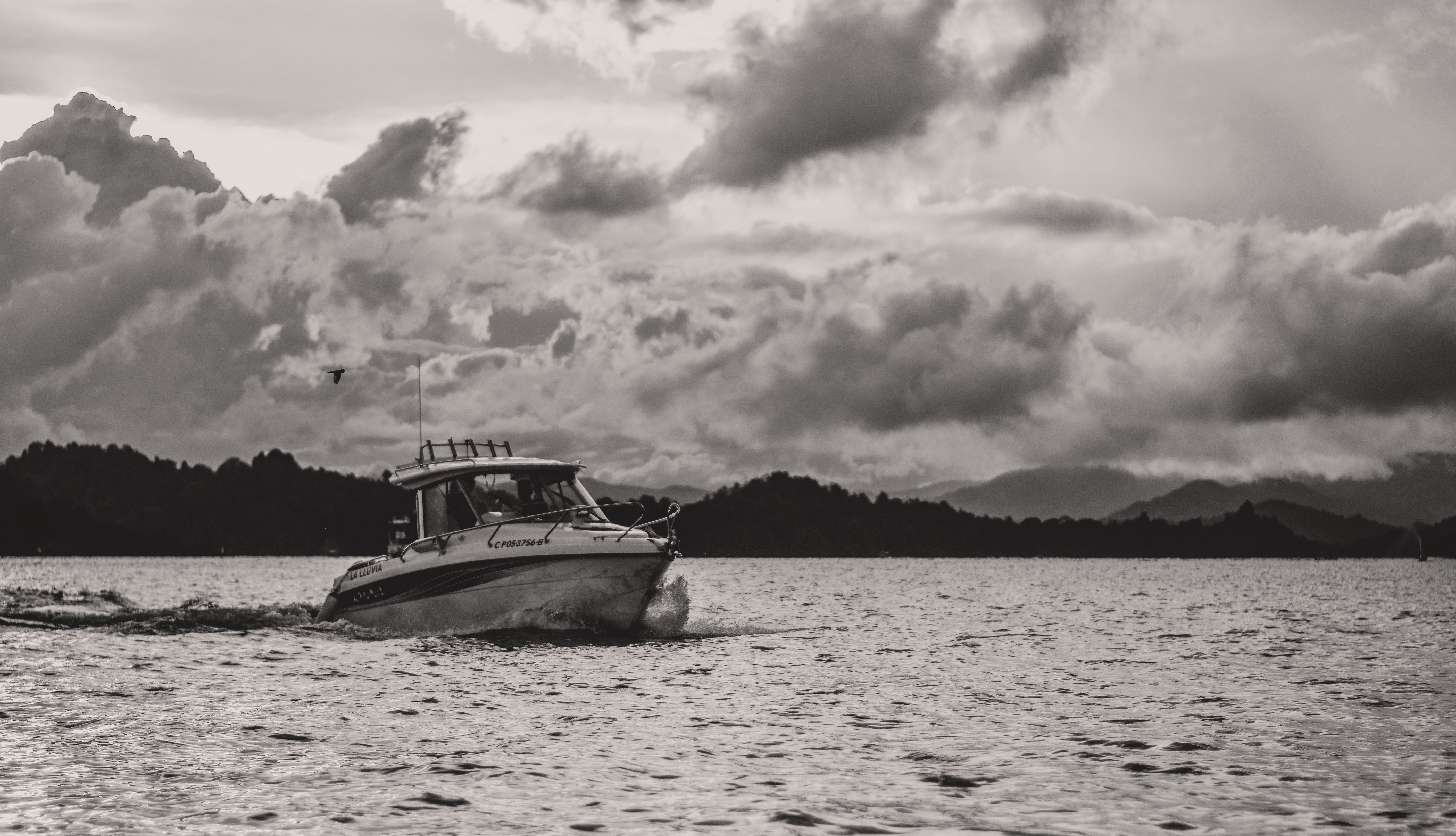 Boat on Sea Under Cloudy Sky · Free Stock Photo