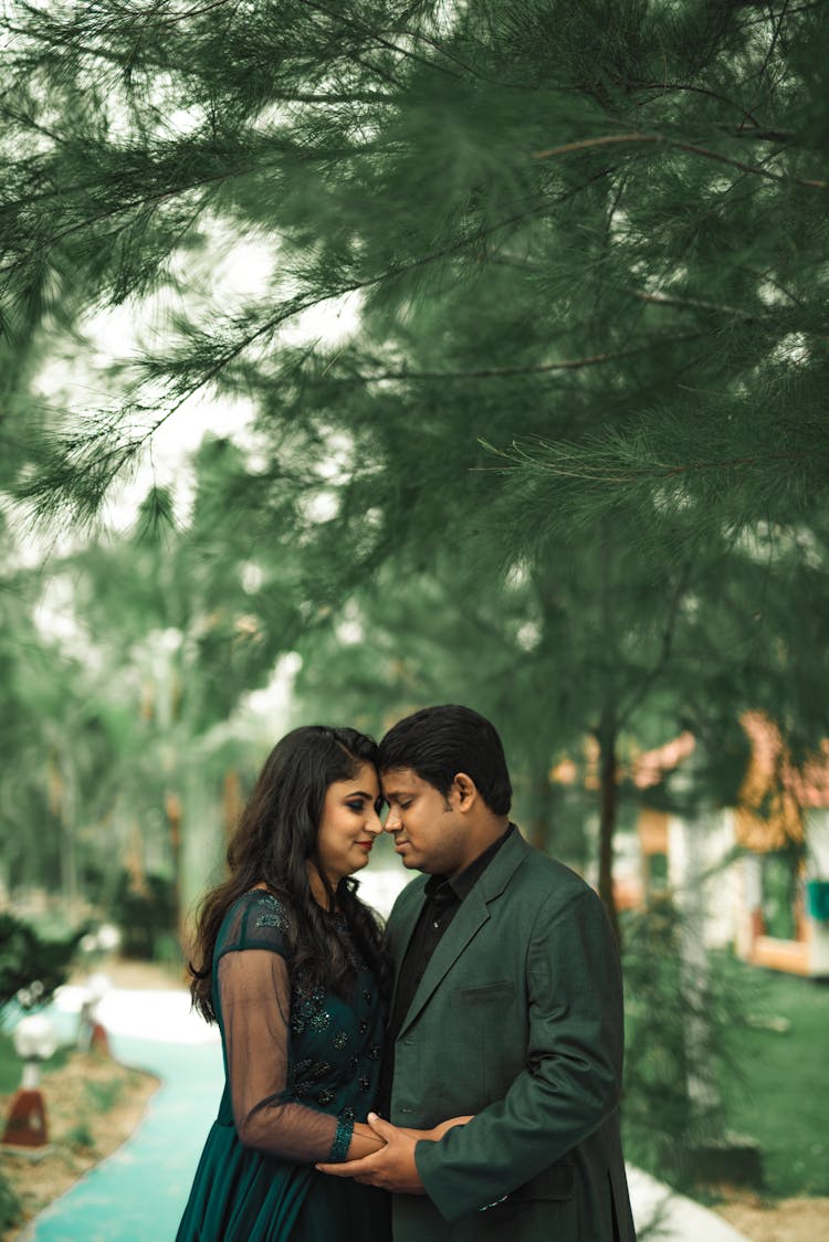 Couple Hugging Near Tree