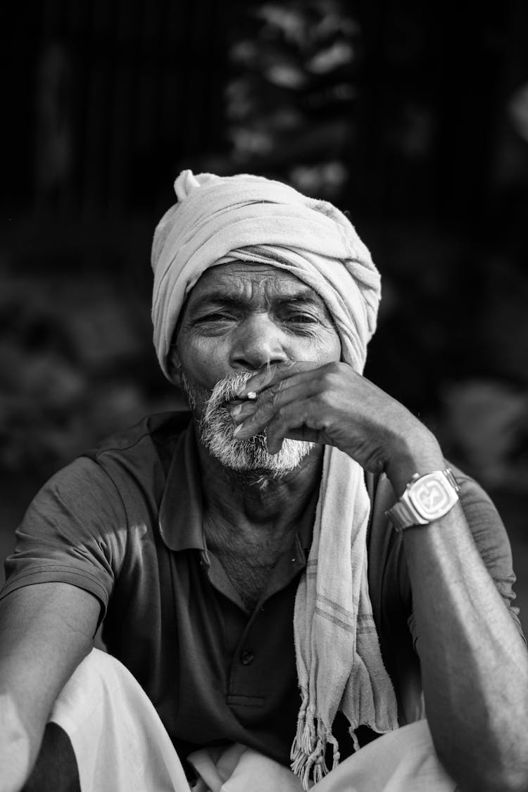 Old Man In Turban Smoking Cigarette