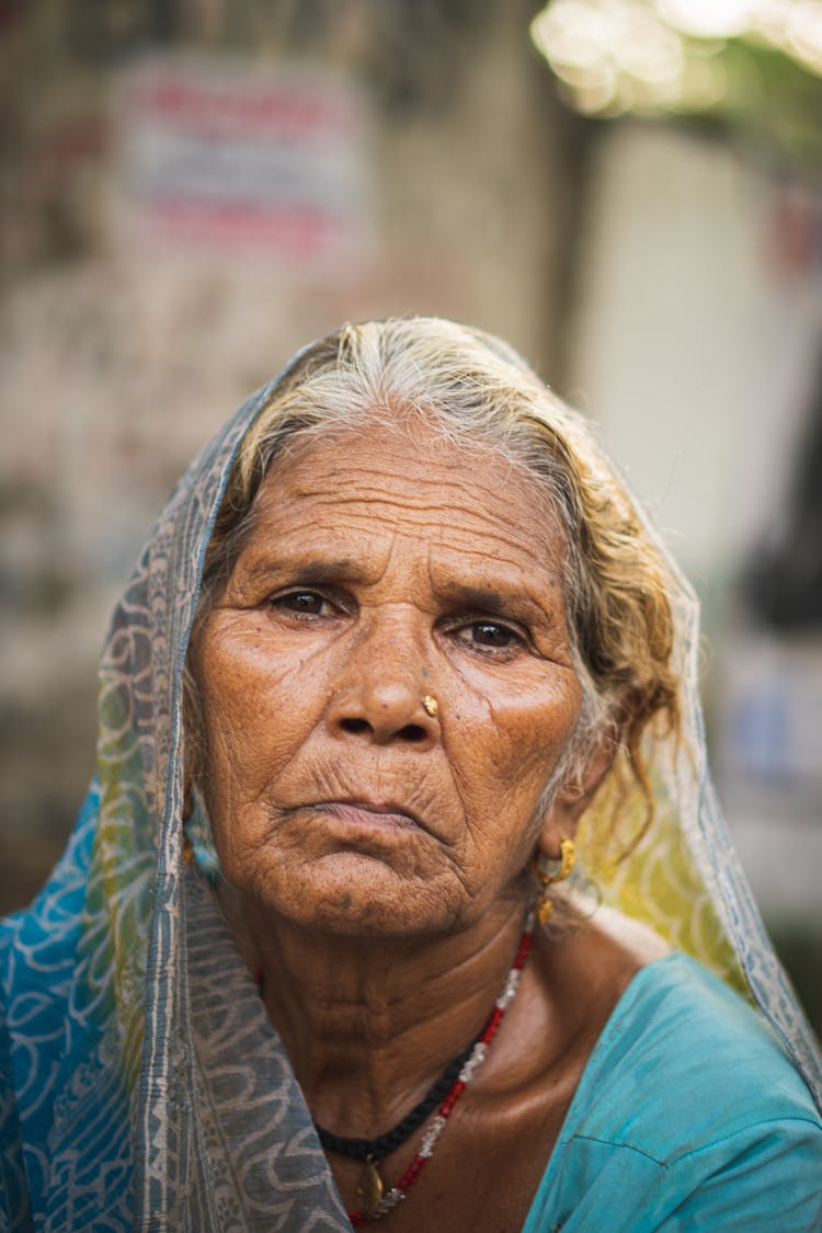 Portrait Of Old Woman In Traditional Clothes