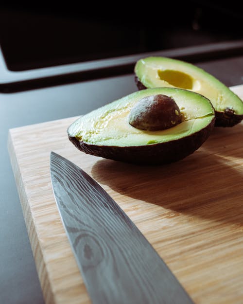 Sliced Avocado on Wooden Chopping Board
