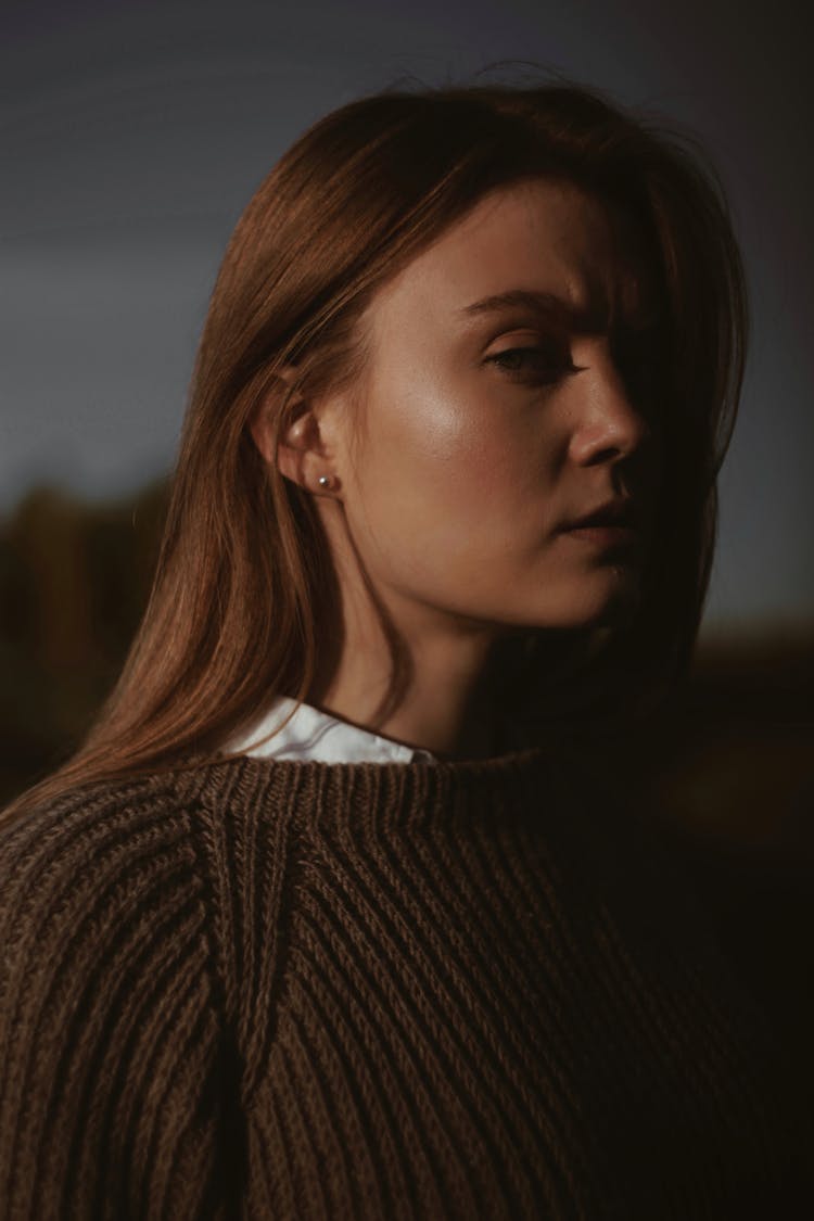 Blonde Model In Sweater Posing Outdoors