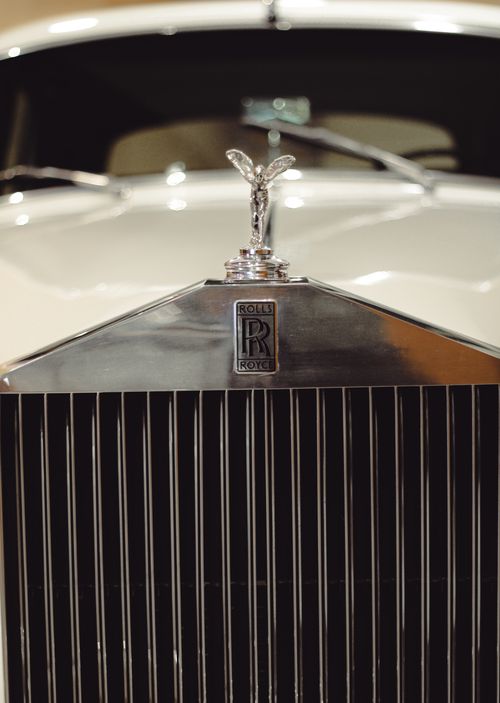 Free Detailed image of a Rolls Royce luxury car grille and emblem highlighting opulence. Stock Photo