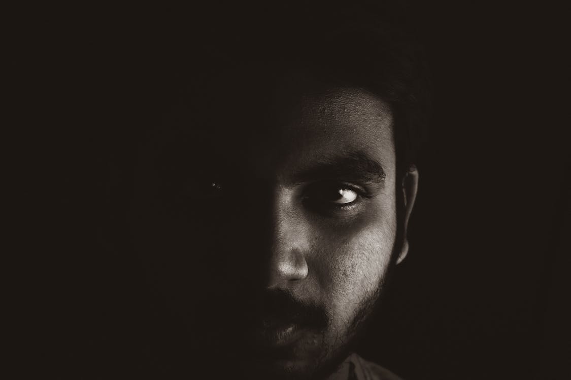 Close-up Photo of Man in Dark