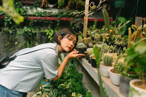 Woman Posing with Succulent in Store