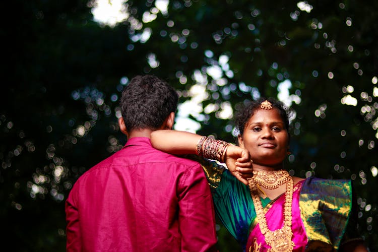 A Woman Leaning On The Man