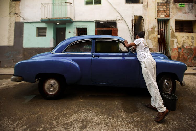 Man Cleaning A Car