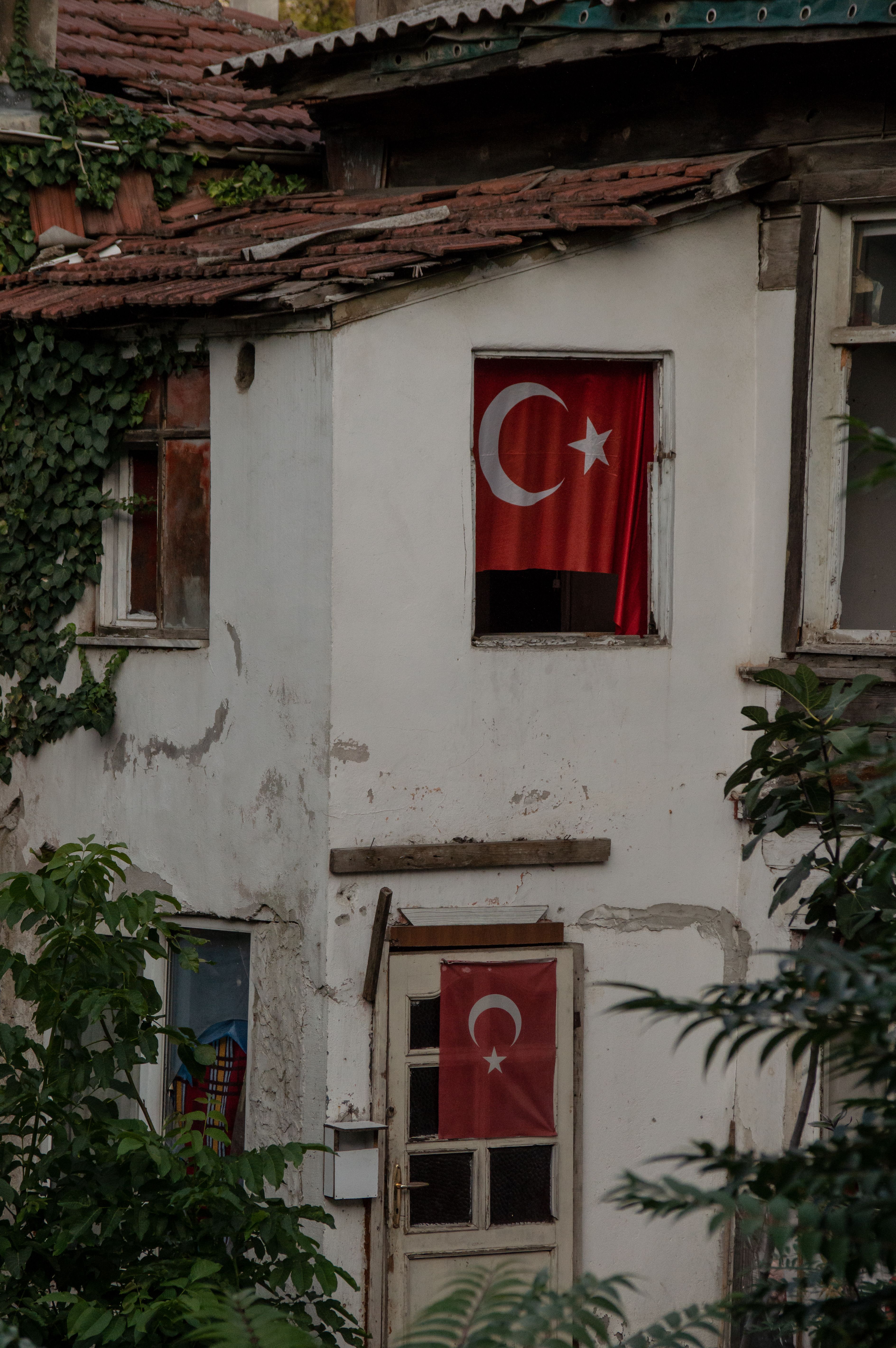 Old Building Facade with Turkish Flags in the Windows · Free Stock Photo