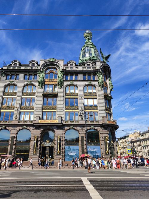 Free The iconic Singer House facade on a clear day in St. Petersburg, Russia, bustling with tourists. Stock Photo