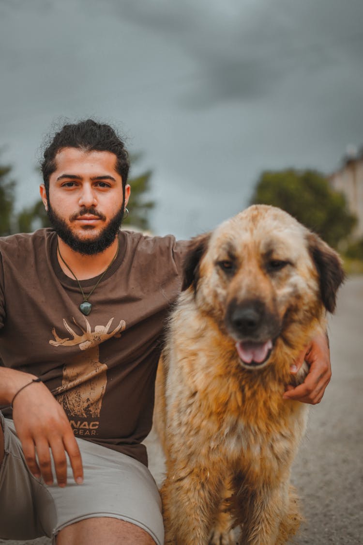 A Bearded Man With His Dog