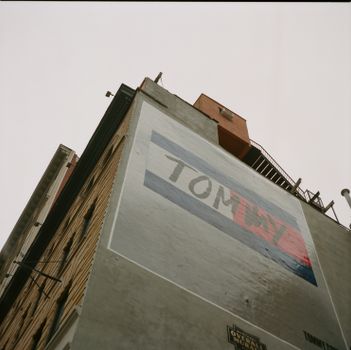 Low Angle Photography of Brown Concrete Building With Painting 