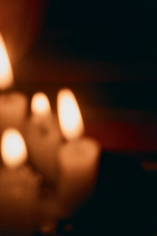 White Candles on Brown Wooden Table