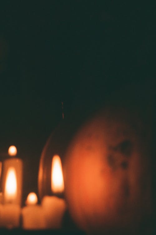 Lighted Candles in Dark Room