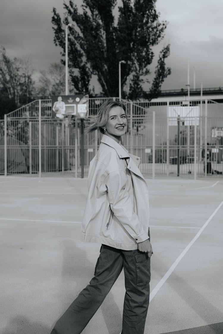 Young Woman On A Court Smiling 