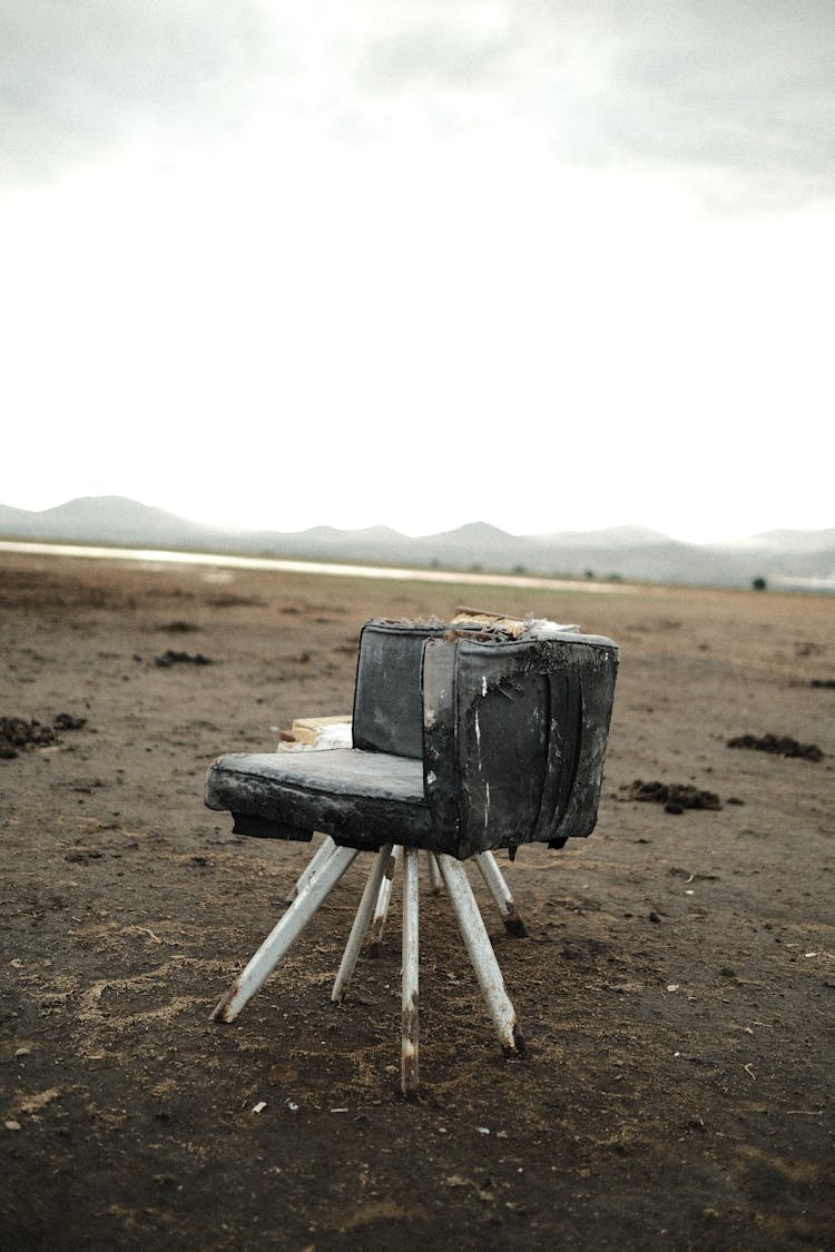 Abandoned Chair On The Field