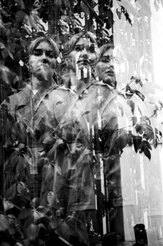 Creative black and white portrait with motion and reflection effects of a woman.