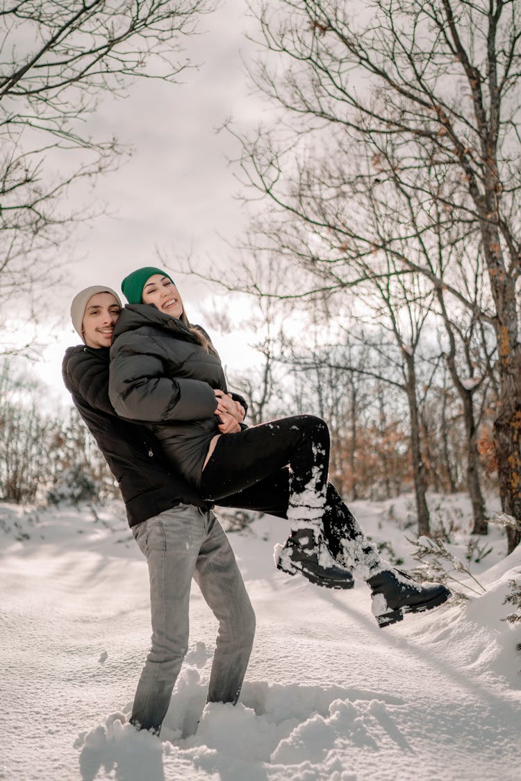 Happy Couple Having Fun In Winter Forest