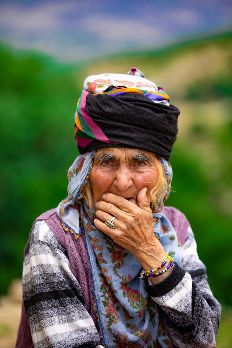 Old Woman In Traditional Clothes Outdoors