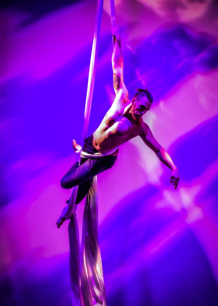 Man Dancing On Aerial Silks 