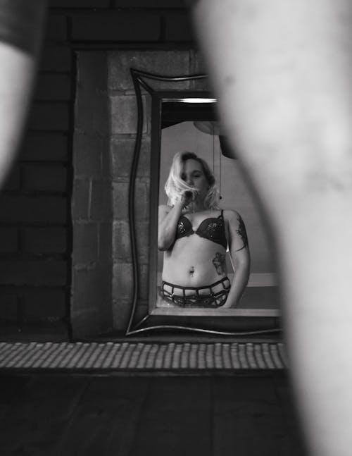Reflection of Woman in Bikini in Mirror