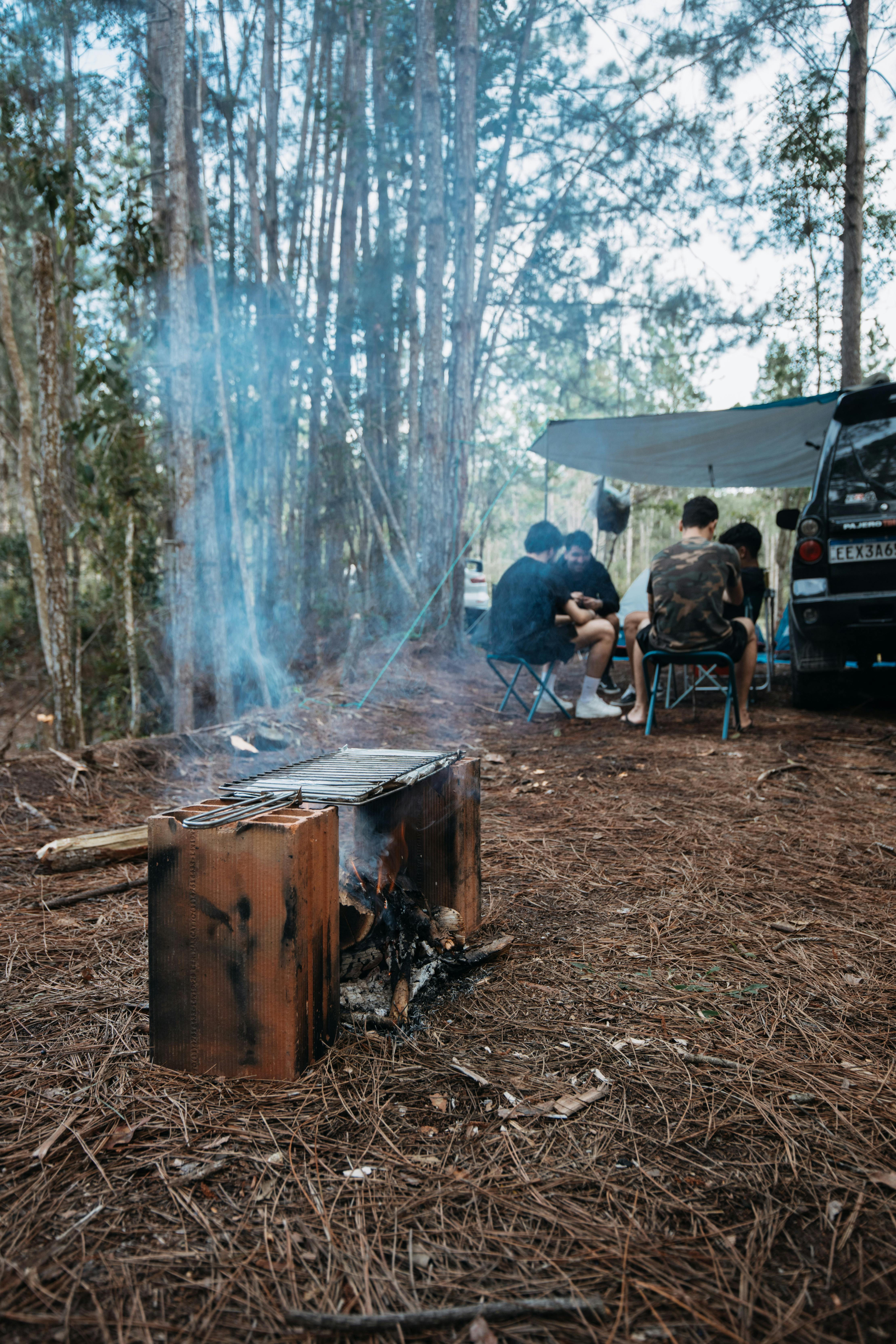 Empty forest campsite with fire ring and picnic table