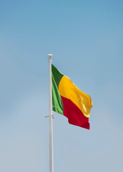 Benin National Flag Under Blue Sky