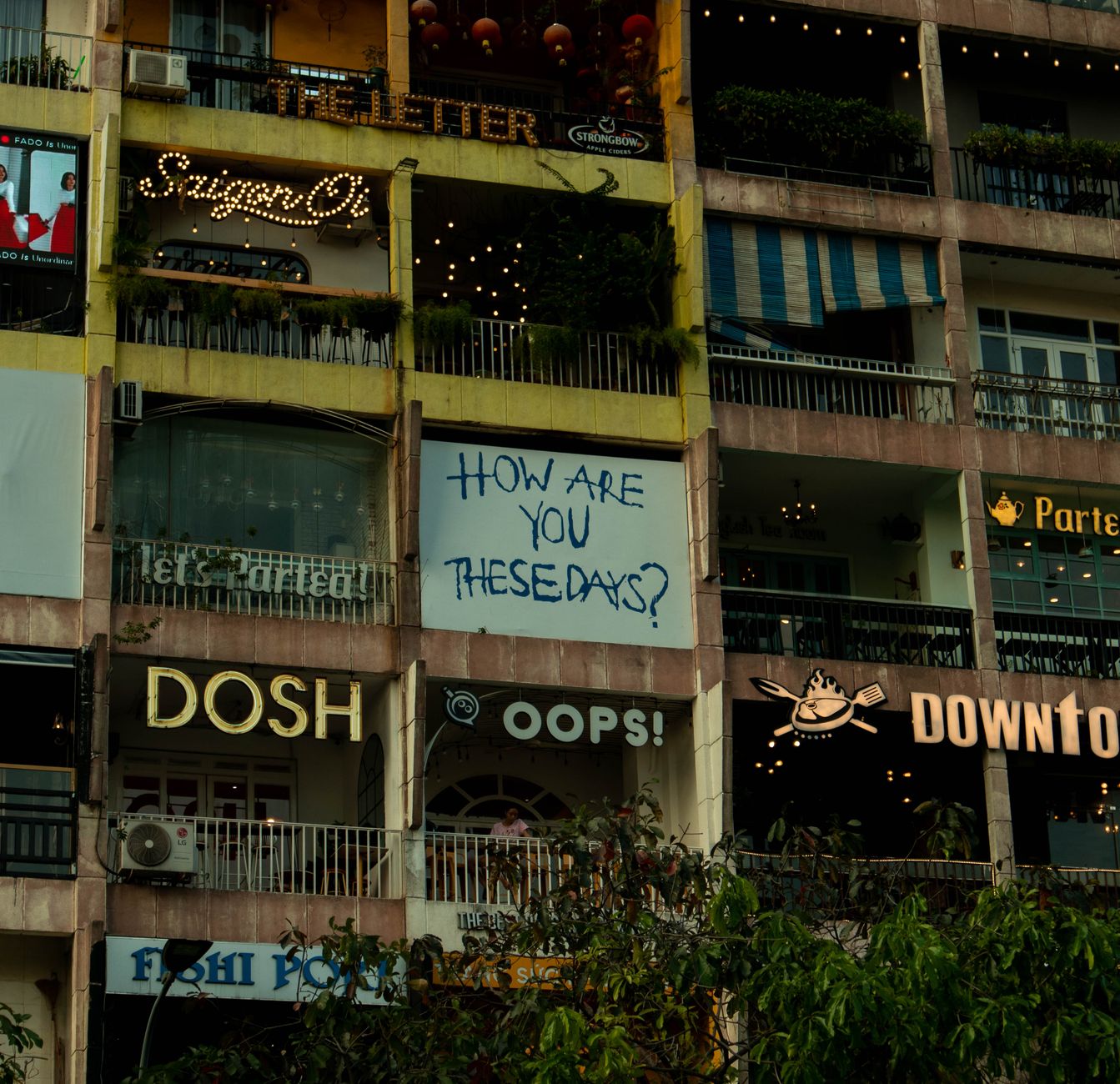 A colorful city building featuring neon signs and text displays, capturing urban vibrancy.