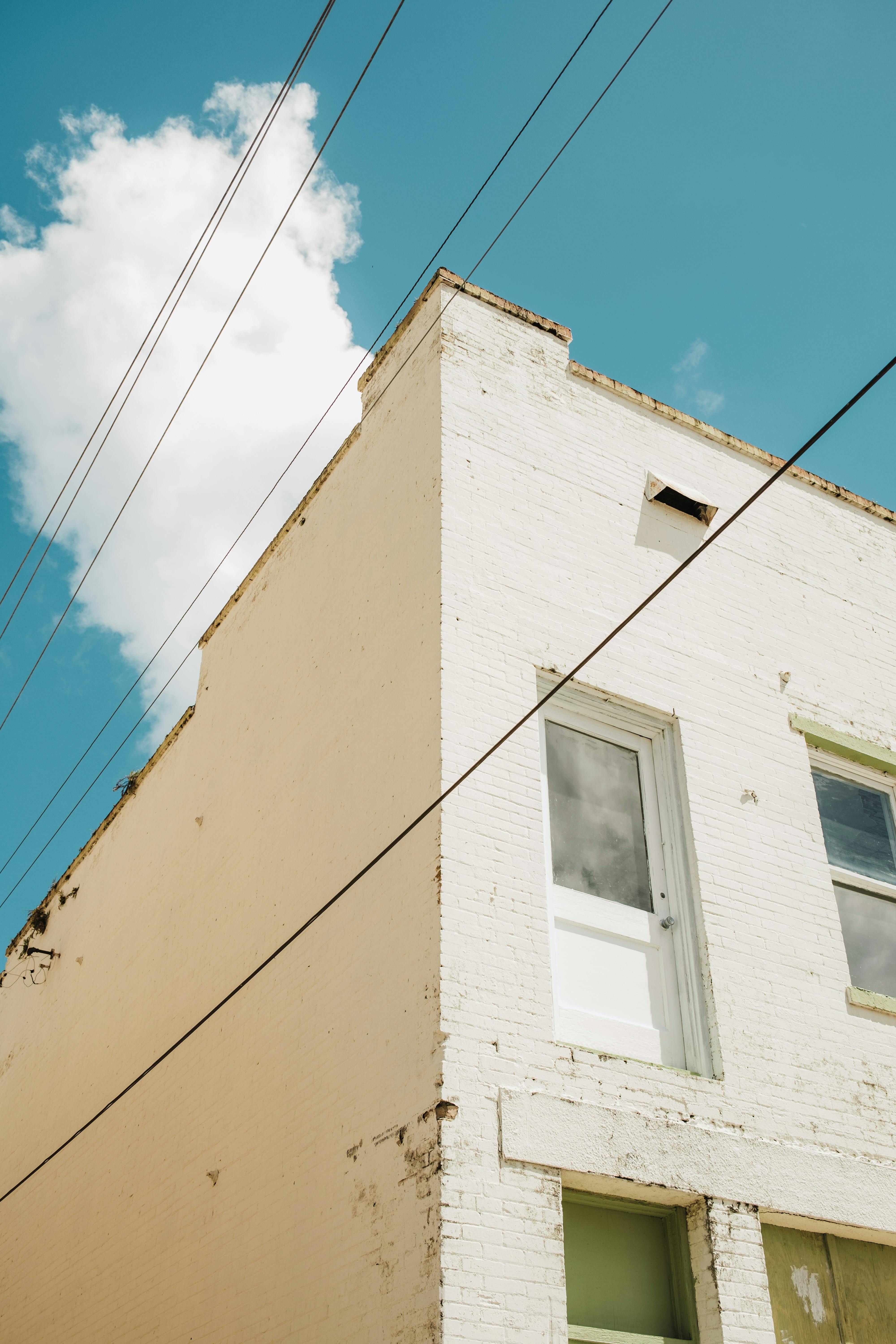 Pair of Shoes Hanging on Electric Wire · Free Stock Photo